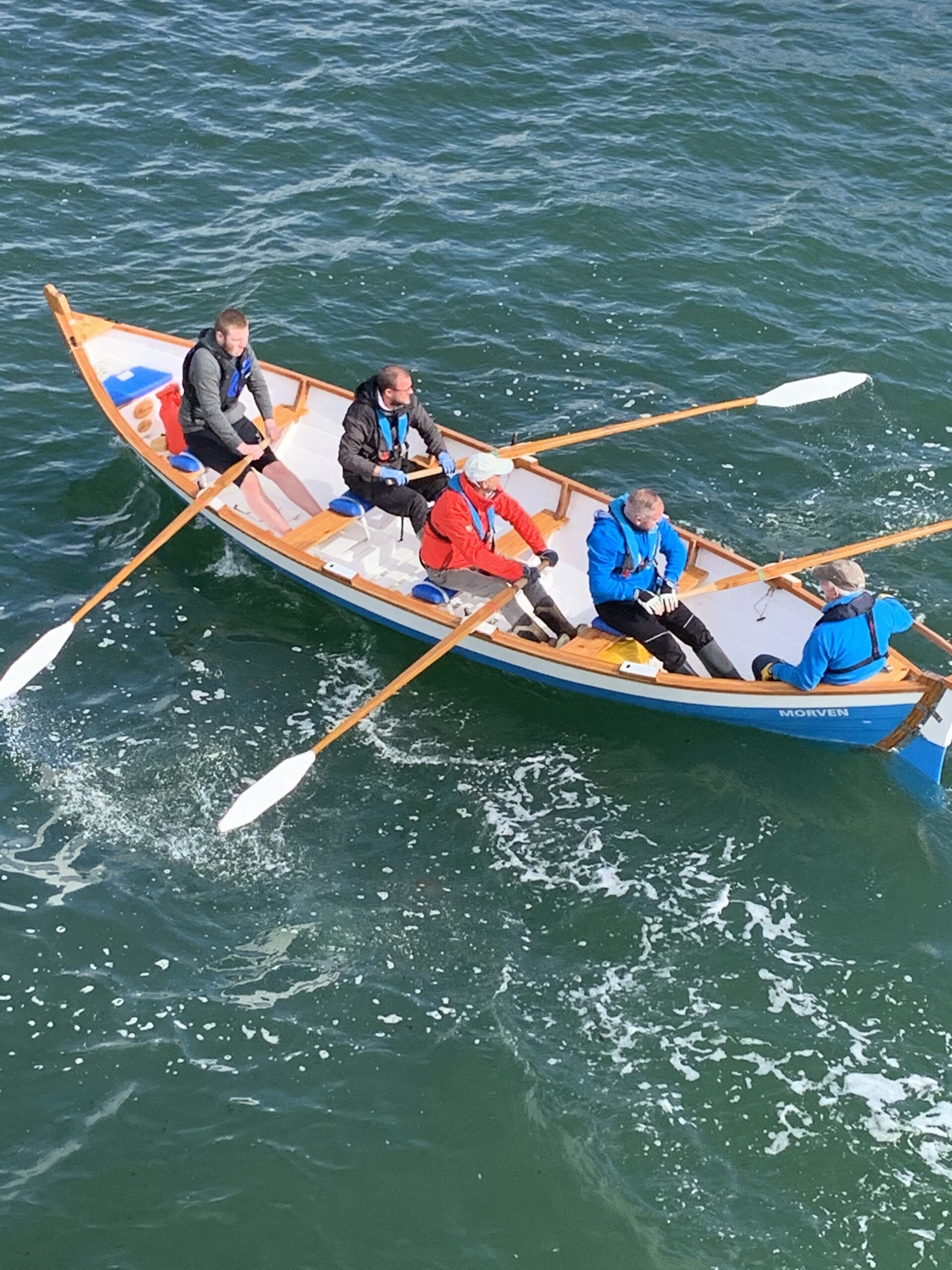 Four rowers and a cox in a St Ayle's skiff